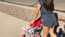 Child with baby stroller